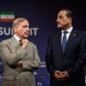 Pakistan's Prime Minister Muhammad Shehbaz Sharif (L) stands with Pakistan's Chief of Army Staff Field Marshal Asim Munir prior to a quadrilateral meeting between the United States, Iran, Pakistan and Qatar at the Burgenstock luxury hotel complex overlooking Lake Lucerne, Switzerland, on June 21.