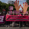 Code Pink activists take part in a pro-Palestinian march on the sidelines of the Democratic National Convention (DNC), in Chicago, Illinois, US, August 19, 2024.