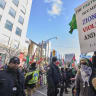 Police form a barrier between Al-Quds day protesters and pro-Israel counter protestors near the US Consulate in Toronto, Ontario, on March 14, 2026; illustrative