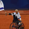 GUY SASSON proudly waves the Israeli flag after winning the bronze at the 2024 Paralympics in Paris; illustrative