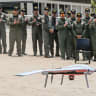 Philippine military personnel observe as a drones flies in Mariveles, Province of Bataan on April 8, 2025, at a handover ceremony where the Australian government donated 20 units of Unmanned Aerial System (UAS) to the Philippine Coast Guard (PCG).