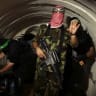 A terrorist from the Izz el-Deen al-Qassam Brigades, the armed wing of the Hamas movement, gestures inside an underground tunnel in Gaza.