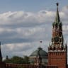 The Russian flag flies on the dome of the Kremlin Senate building behind Spasskaya Tower, in central Moscow, Russia, May 4, 2023. 