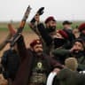 Members of Syrian Democratic Forces react after withdrawing from the front lines on the outskirts of the town of Tel Hamis following the agreement between the SDF and the Damascus government, which stipulates the withdrawal of the Syrian army and the SDF, in Qamishli, Syria, February 13, 2026. 