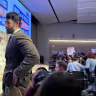 Hasan Piker looks on as U.S. Senate candidate Abdul El-Sayed delivers a stump speech in Ann Arbor, Michigan, April 7, 2026.