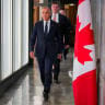 Canada’s Prime Minister Mark Carney walks to speak with the news media after he suspended trade negotiations with the United States, in Ottawa, Ontario, Canada August 22, 2026.