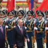 Russian President Vladimir Putin and Chinese President Xi Jinping inspect an honor guard during a welcoming ceremony at the Great Hall of the People state building in Beijing in May. 