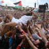 Bob Vylan crowdsurfs in front of the West Holts stage during day four of Glastonbury festival 2025 at Worthy Farm, Pilton on June 28, 2025 in Glastonbury, England. 