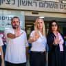 Friends and colleagues of attorney Arbel Feldman stand in his memory outside a remand hearing for suspected killer Ahmad al-Rajoub at the Rishon Lezion Magistrate's Court earlier this month.