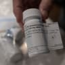 Menta "Steve" Wallace shows a bottle of daraxonrasib, Revolution Medicine?s pancreatic cancer drug, at his home in The Woodlands, Texas, U.S., May 29, 2026.
