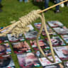 A WOMAN in the Netherlands holds a noose while standing near images of killed Iranian political prisoners, in 2024.