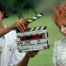 Second camera assistant Beth Horton marks another take as Dolly Parton is filmed in the Lifetime channel TV movie "The Blue Valley Songbird" in the Bethel Community of Maury County, Tennessee, US, July 28, 1999