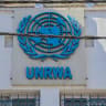 The UNRWA emblem is displayed on a building at the Kalandia Training Center in Qalandia refugee camp, West Bank, on August 25, 2026.