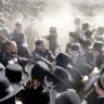 Israeli police clash with haredi protesters during a mass demonstration against military conscription outside the Beit Lid military base in June. 
