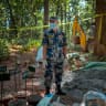 Police prepare the mass burial site for the unidentified victims of the flash floods at Devghat Forest on August 30, 2026 in Bharatpur, Nepal.