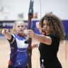 A woman draws her bow at a Warriors of Israel event.