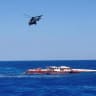 A helicopter flies during a rescue operation after a ferry that capsized off the coast of Northern Cyprus, August 30, 2026, in this screengrab taken from a video.