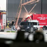 A video grab taken from footage by News5 from August 5, 2026 shows emergency services, police and firefighers deployed at German airport Leipzig-Halle in Schkeuditz, eastern Germany, after a drone was spotted nearby.