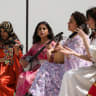 Artists perform, as Kurdish female fighters attend a military parade to mark the 13th anniversary of the founding of the Women's Protection Units (YPJ) in Qamishli, Syria, April 4, 2026.