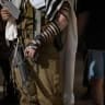An Israeli soldier pray at the Western Wall, Judaism’s holiest prayer site in the Old City of Jerusalem.