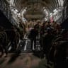 US Soldiers, assigned to the 82nd Airborne Division, deplane a U.S. Air Force C-17 Globemaster III aircraft after touching down at Ali Al Salem Air Base, Kuwait.