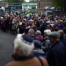Members of the community gather for a vigil and one miniute silence at Heaton Park Hebrew Synagogue on October 09, 2025 in Manchester, England.