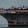 The US Navy Nimitz-class aircraft carrier USS Abraham Lincoln sails toward Laem Chabang Port before docking for a rest stop following a long deployment in the Middle East, with the Pattaya skyline in backdrop, in Chonburi province, Thailand, September 2, 2026.