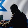 An illustrative image of a shadowed Israeli security official.