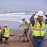 Workers operate on a lead line connected to fiber optic cable at Arrietara beach, near Bilbao, northern Spain, June 13, 2017, as Facebook Inc. and Microsoft Corp. join forces to build an underwater fiber optic cable across the Atlantic Ocean, linking Europe and the USA.