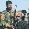 KURDISH FIGHTERS from the Qamishli Brigade on parade last month.