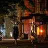 A woman walks along a street on a warm evening, amid Russia's attack on Ukraine, in central Kyiv, Ukraine, September 1, 2026. 