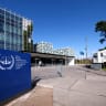 People stand outside the International Criminal Court in the Hague, Netherlands.