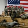 US troops from the Army's 82nd Airborne Division wait at Green Ramp before they head out for a deployment to the Middle East on January 4, 2020 in Fort Bragg, North Carolina. 