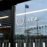 The IAEA logo is displayed in front of the agency’s headquarters in Vienna, Austria, June 5, 2026. 