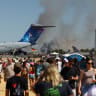 People watch as smoke rises following the crash of a Greek F-4 Phantom fighter jet during the Athens Flying Week air show in Tanagra, Greece, September 5, 2026. 
