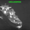 Fire and smoke rise during what U.S. Central Command (CENTCOM) says are strikes on Iranian oil carriers, at an unknown location in this screengrab taken from a handout video released on September 5, 2026. 