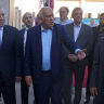  PALESTINIAN-ISRAEL-CONFLICT-WEST BANK Palestinian Vice President Hussein Al-Sheikh (L) and head of the Palestinian Football Association and Palestine Olympic Committee, Jibril Rajoub (C) arrive to attend the football match between Jabal Al-Mukaber and Shabab Al-Khalil teams.