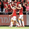 HAPOEL TEL AVIV players celebrate their 3-0 victory over Beitar Jerusalem at Bloomfield as the Reds continue to roll early on in the Premier League season.
