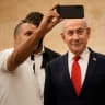 A man takes a selfie with Prime Minister Benjamin Netanyahu during Likud party primary elections ahead of Israel’s general election in October, in Jerusalem, Monday, August. 17, 2026.