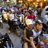 Hundreds of motorcyclists seen driving in traffic in Hanoi, Vietnam. October 02, 2013.