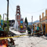A Mexican State Police officer inspects the site of a fireworks blast during a patronal festival in Santa Maria Canchesda, Mexico state, Mexico on September 6, 2026.