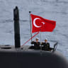 Turkey's servicemen stand at attention on a Turkish submarine as they participate in the live-fire phase of the "Blue Homeland-2026" (Mavi Vatan) tactical military exercises in the eastern Mediterranean Sea, in Antalya on April 9, 2026.