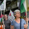 Demonstrators wave Palestinian flags and chant against Israel’s and America’s war with Iran in front of the Israeli embassy in Portugal in May. 