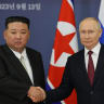 Russian President Vladimir Putin (R) and North Korea's leader Kim Jong Un (L) shaking hands during their meeting at the Vostochny Cosmodrome in Amur region on September 13, 2023.
