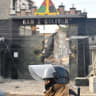 A military officer walks through the affected area a day after loud explosions that left people dead and injured at a military barracks, in Viacha, Bolivia, September 5, 2026.