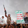 A boy holds up a toy weapon as he joins Houthi supporters during an anti-Saudi rally amid an escalation with the kingdom, in Sanaa, Yemen, July 31, 2026. 