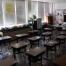 Unused desks are seen in an empty elementary school classroom during a period of Non-Traditional Instruction (NTI) at Hazelwood Elementary School on January 11, 2022 ; illustrative