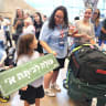 New olim at Ben Gurion Airport greeting first graders 