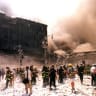 FILE PHOTO: New York City firefighters and other emergency personnel battle building blaze after the World Trade Center buildings collapse September 11, 2001.