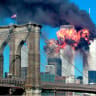 FILE PHOTO: The second tower of the World Trade Center explodes into flames after being hit by a airplane, New York September 11, 2001 with the Brooklyn bridge in the foreground.